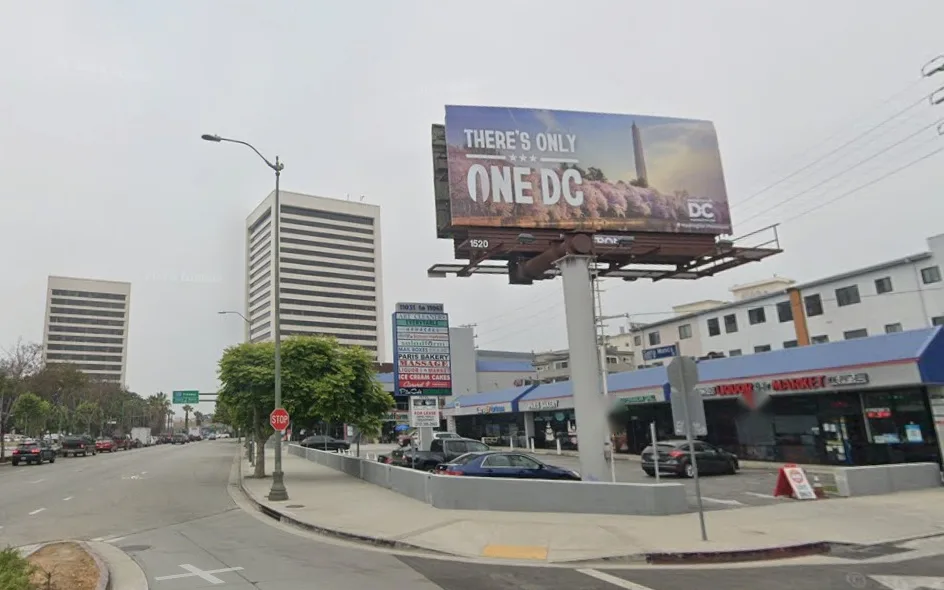The corner of Santa Monica Plaza on Santa Monica Blvd, with the tall 11031 to 11061 sign
